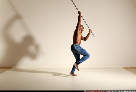 Man Adult Athletic Black Fighting with spear Moving poses Pants