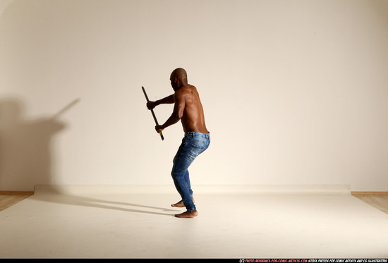 Man Adult Athletic Black Fighting with spear Moving poses Pants