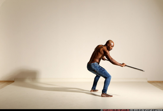 Man Adult Athletic Black Fighting with spear Moving poses Pants