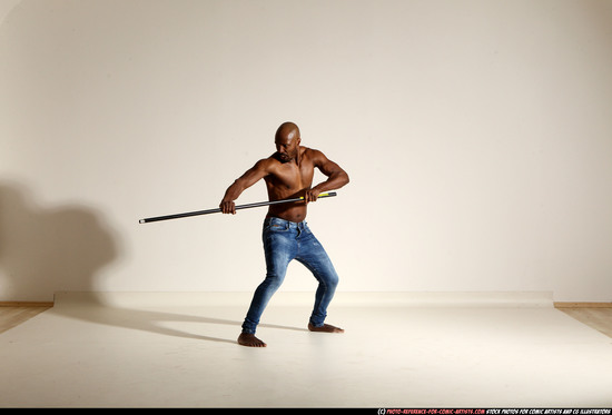 Man Adult Athletic Black Fighting with spear Moving poses Pants