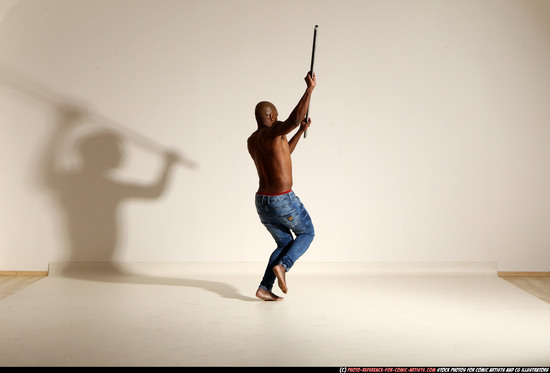 Man Adult Athletic Black Fighting with spear Moving poses Pants