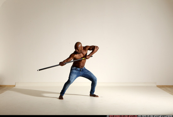 Man Adult Athletic Black Fighting with spear Moving poses Pants