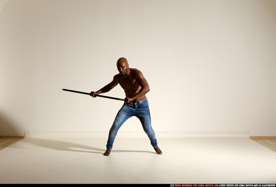 Man Adult Athletic Black Fighting with spear Moving poses Pants