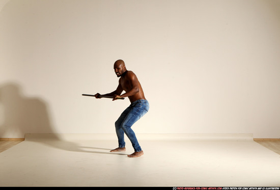 Man Adult Athletic Black Fighting with spear Moving poses Pants