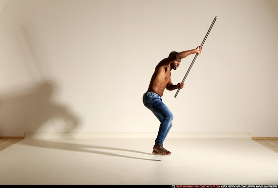 Man Adult Athletic Black Fighting with spear Moving poses Pants