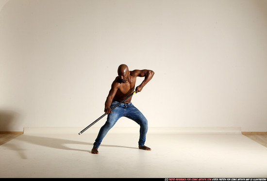 Man Adult Athletic Black Fighting with spear Moving poses Pants