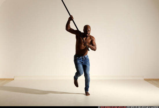 Man Adult Athletic Black Fighting with spear Moving poses Pants