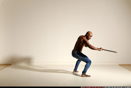 Man Adult Athletic Black Fighting with spear Moving poses Pants