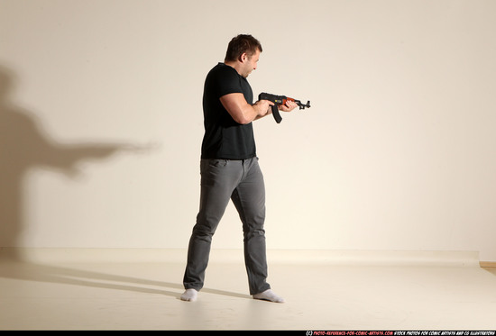 Man Adult Muscular White Fighting with submachine gun Moving poses Casual