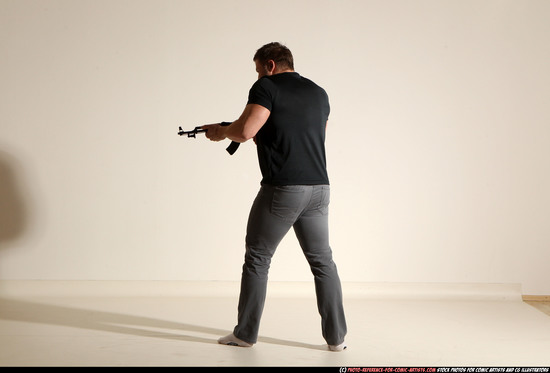 Man Adult Muscular White Fighting with submachine gun Moving poses Casual