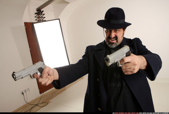 Man Old Average White Fighting with gun Standing poses Coat