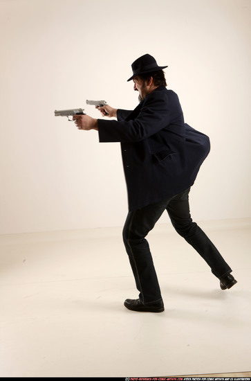 Man Old Average White Fighting with gun Standing poses Coat