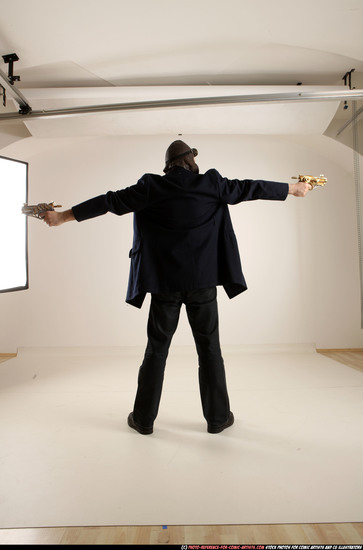 Man Old Average White Fighting with gun Standing poses Coat