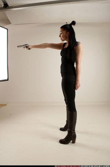 Woman Adult Athletic White Fighting with gun Standing poses Casual