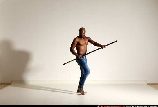 Man Adult Athletic Black Fighting with spear Moving poses Pants