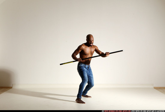 Man Adult Athletic Black Fighting with spear Moving poses Pants