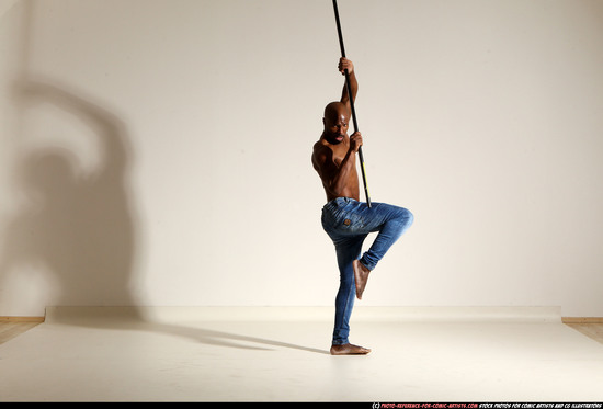 Man Adult Athletic Black Fighting with spear Moving poses Pants