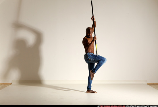 Man Adult Athletic Black Fighting with spear Moving poses Pants