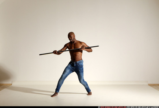 Man Adult Athletic Black Fighting with spear Moving poses Pants