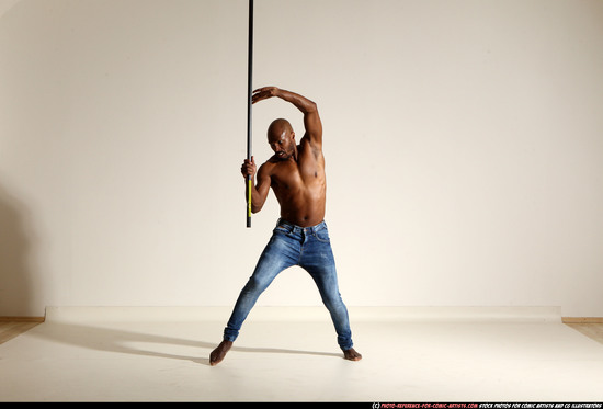 Man Adult Athletic Black Fighting with spear Moving poses Pants