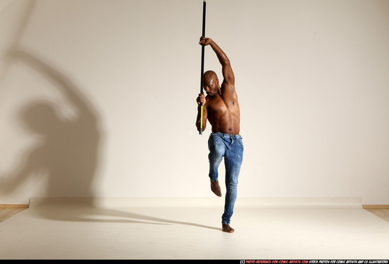 Man Adult Athletic Black Fighting with spear Moving poses Pants