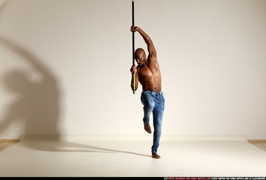 Man Adult Athletic Black Fighting with spear Moving poses Pants