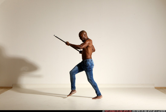 Man Adult Athletic Black Fighting with spear Moving poses Pants