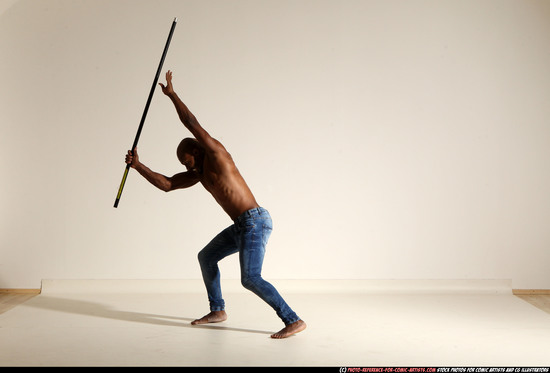 Man Adult Athletic Black Fighting with spear Moving poses Pants