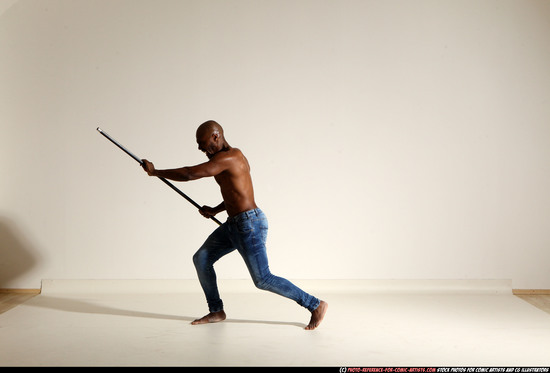 Man Adult Athletic Black Fighting with spear Moving poses Pants