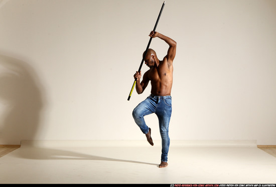 Man Adult Athletic Black Fighting with spear Moving poses Pants