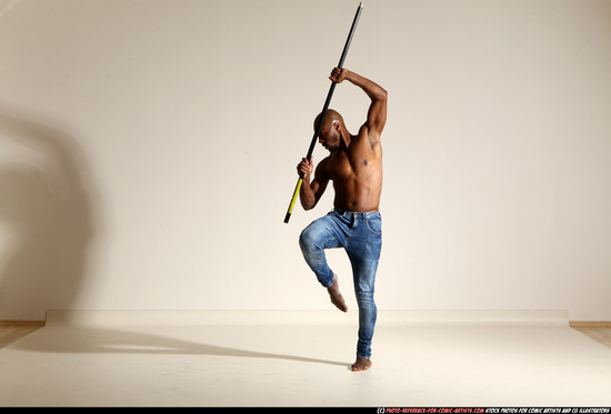 Man Adult Athletic Black Fighting with spear Moving poses Pants