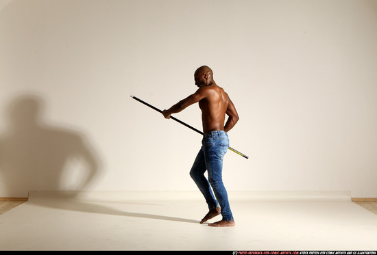 Man Adult Athletic Black Fighting with spear Moving poses Pants