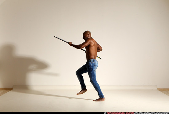 Man Adult Athletic Black Fighting with spear Moving poses Pants