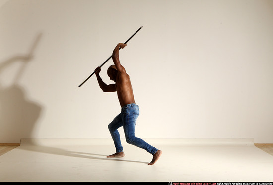 Man Adult Athletic Black Fighting with spear Moving poses Pants