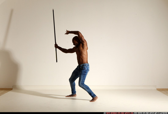 Man Adult Athletic Black Fighting with spear Moving poses Pants