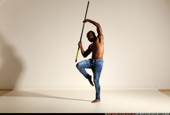 Man Adult Athletic Black Fighting with spear Moving poses Pants