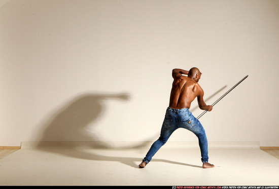 Man Adult Athletic Black Fighting with spear Moving poses Pants