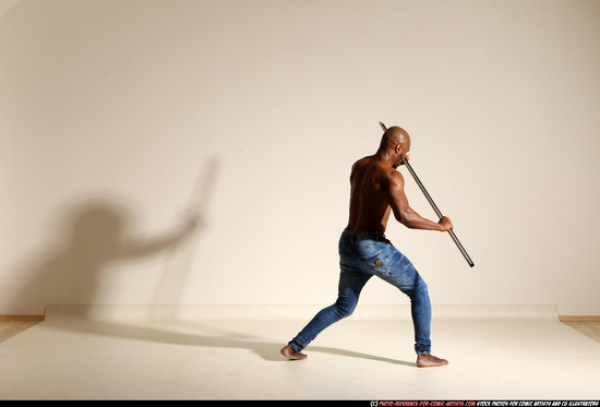 Man Adult Athletic Black Fighting with spear Moving poses Pants