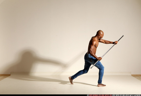 Man Adult Athletic Black Fighting with spear Moving poses Pants