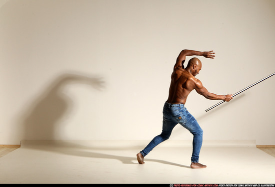 Man Adult Athletic Black Fighting with spear Moving poses Pants