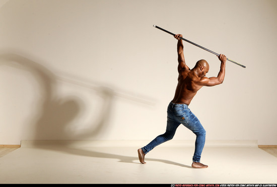 Man Adult Athletic Black Fighting with spear Moving poses Pants