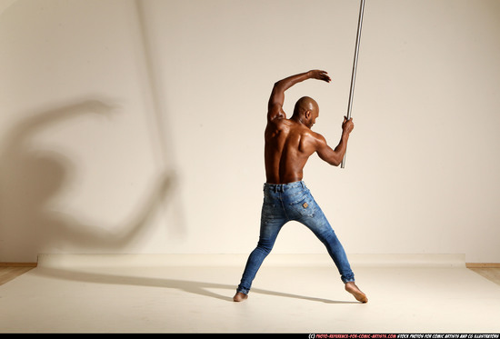 Man Adult Athletic Black Fighting with spear Moving poses Pants