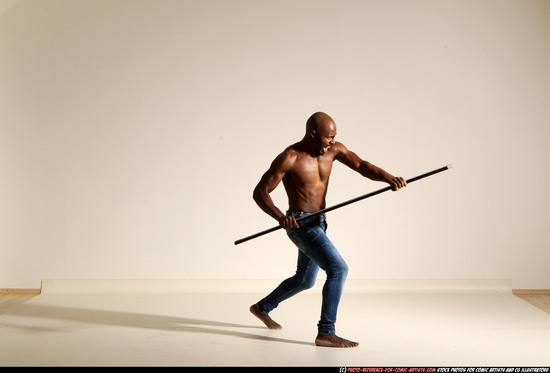 Man Adult Athletic Black Fighting with spear Moving poses Pants