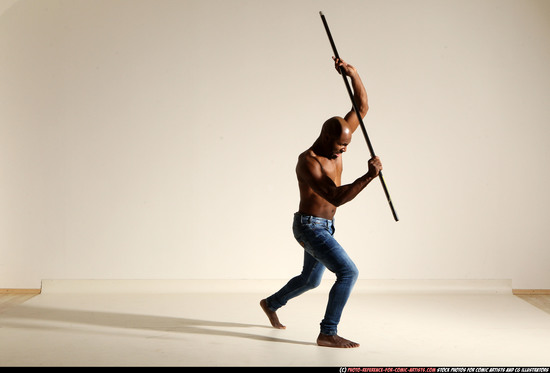 Man Adult Athletic Black Fighting with spear Moving poses Pants