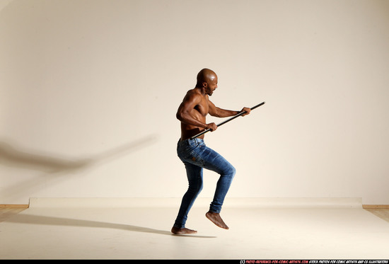 Man Adult Athletic Black Fighting with spear Moving poses Pants