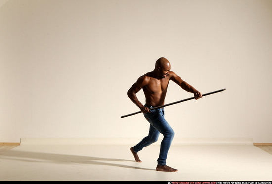 Man Adult Athletic Black Fighting with spear Moving poses Pants