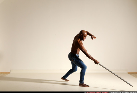 Man Adult Athletic Black Fighting with spear Moving poses Pants