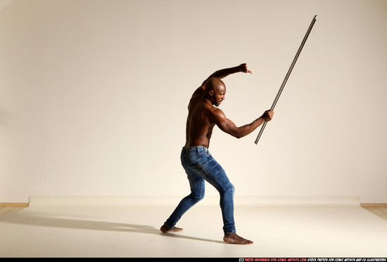 Man Adult Athletic Black Fighting with spear Moving poses Pants