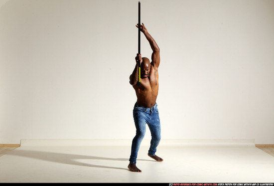 Man Adult Athletic Black Fighting with spear Moving poses Pants