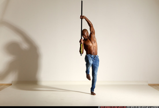 Man Adult Athletic Black Fighting with spear Moving poses Pants